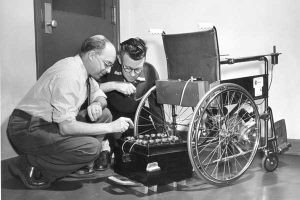 Figure 2: Electric wheelchair pioneer George Klein (left) and his NRC colleague Robert Owens with an early prototype. Source: The National Research Council of Canada.